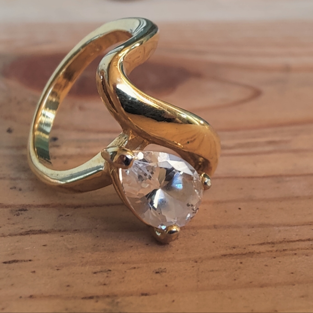 Vintage handcrafted twisted golden ring with zircon